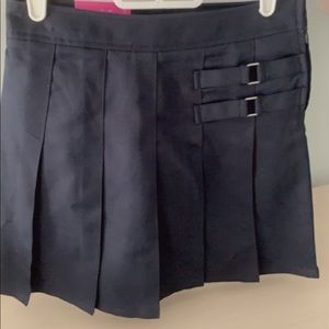 Navy school shirt with shorts built in.